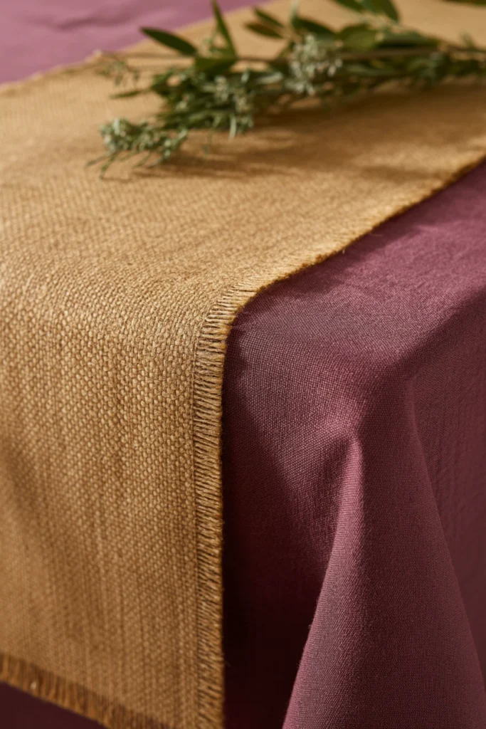 9. Add a Textured Table Runner Over a Solid Cloth