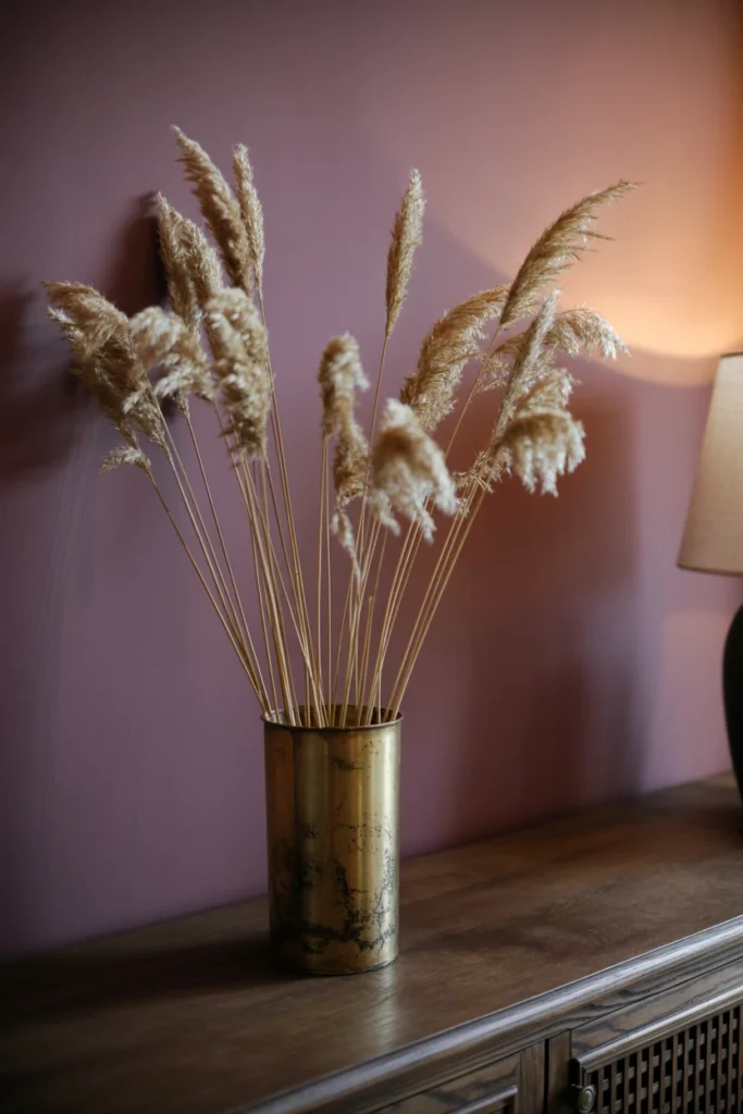 Dried pampas grass in antique brass vessel