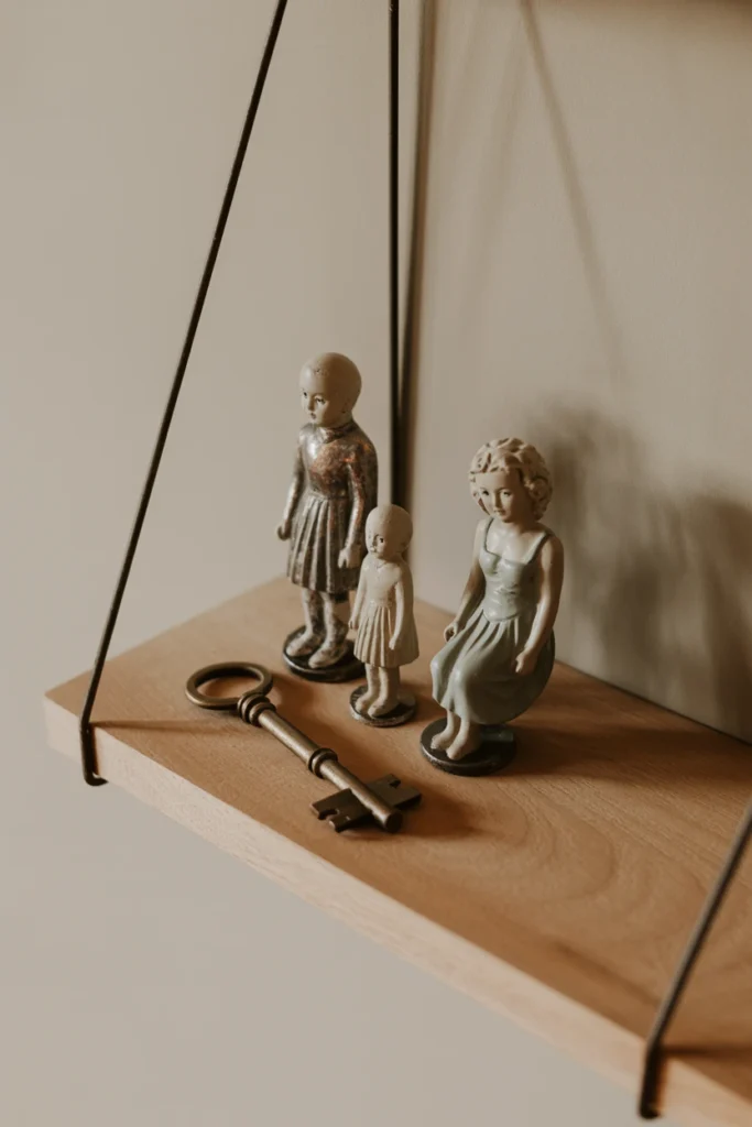 Floating shelf styled with a grouped odd-numbered vignette