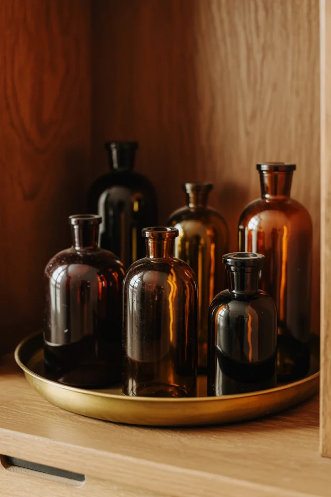 Vintage apothecary bottles grouped on a brass tray