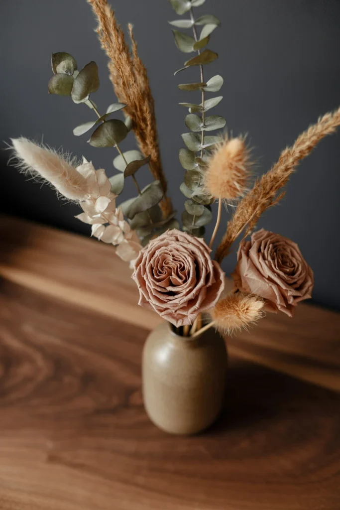 Dried pampas grass and eucalyptus in odd-numbered vase grouping