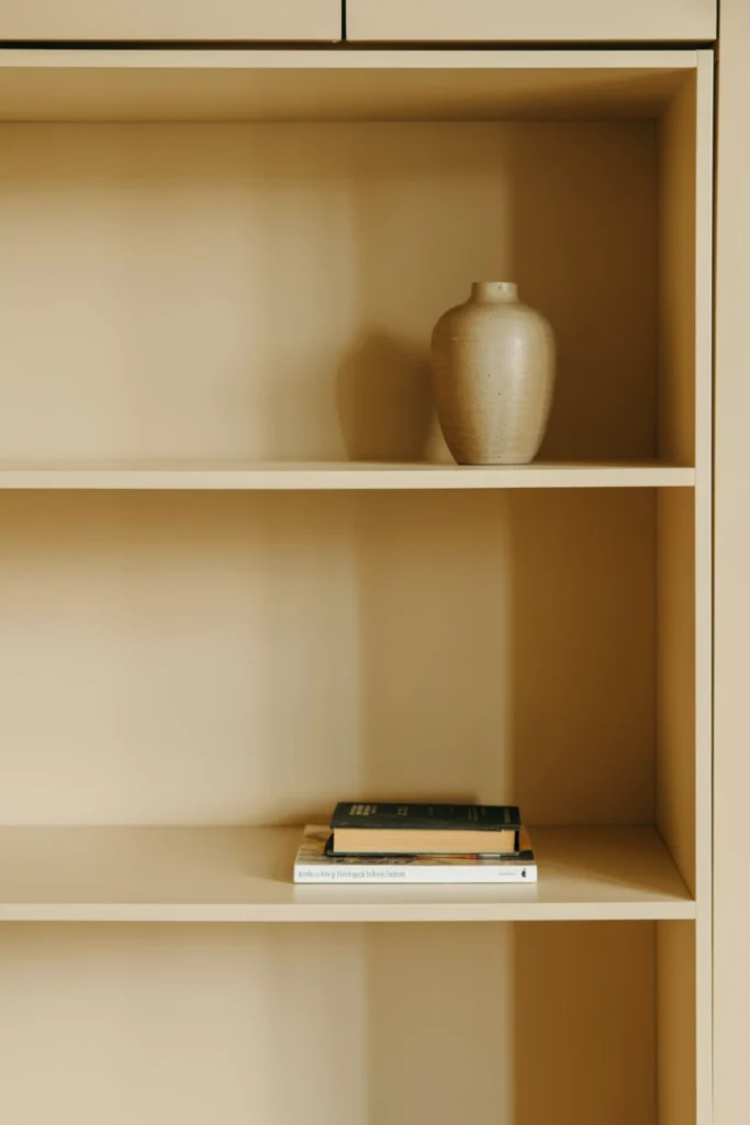 Decluttered shelf with one object removed to maintain balance