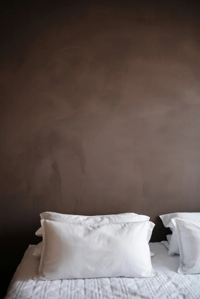 Paint walls in a deep magnolia-inspired charcoal shade