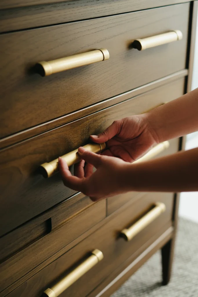 Install brass or gold hardware for feminine warmth