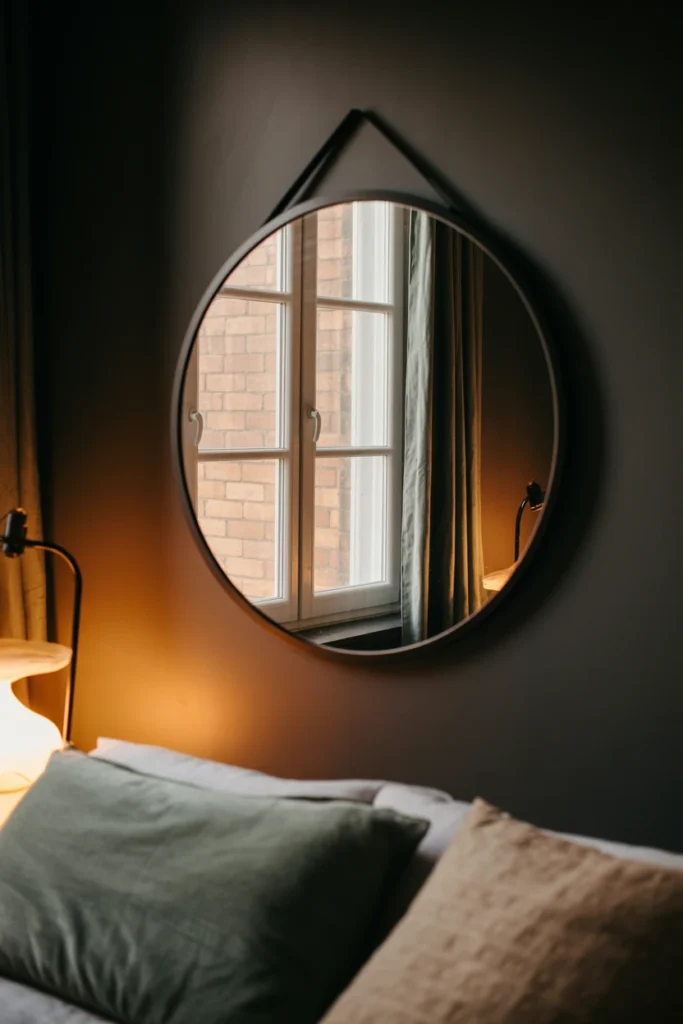 Mount an oversized mirror opposite your main light source