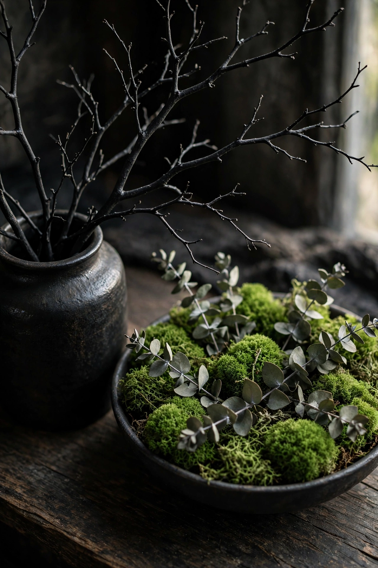 bare branches and sheet moss replacing plastic props in witch party decor