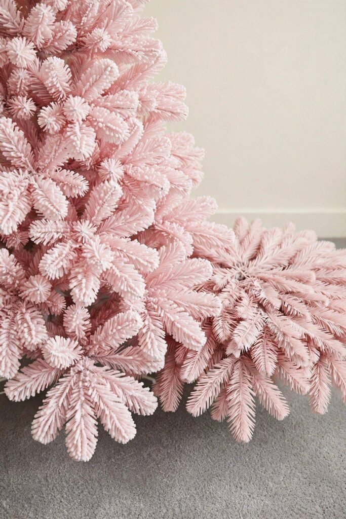 Fluffed and unfluffed pink Christmas tree branches compared side by side